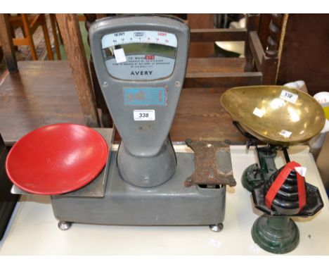 A pair of Avery shop scales; a pair of cast iron kitchen scales with weights