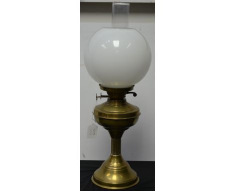 An early 20th century lacquered brass oil lamp, fluted columnar pedestal, circular base