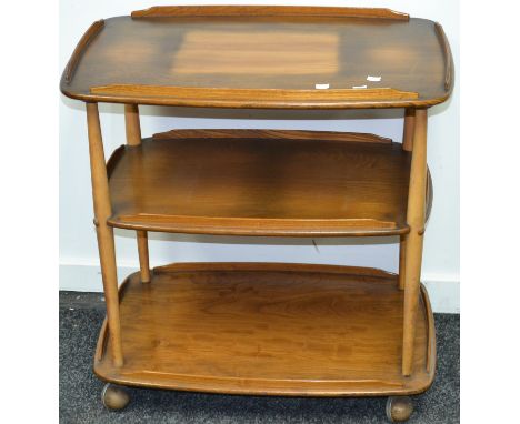 An Ercol three tier tea trolley.