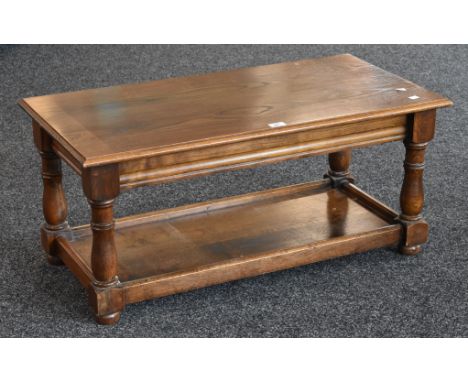 A large oak coffee table, shelf undertier