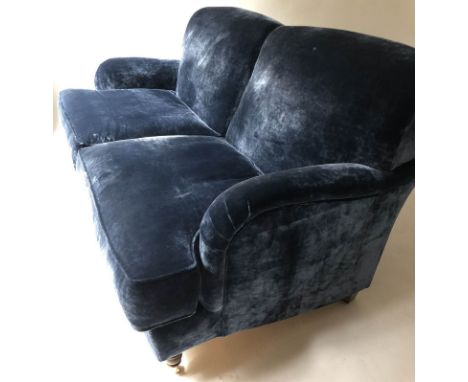 HOWARD STYLE SOFA, blue velvet upholstered and turned front supports on castors, 180cm W.