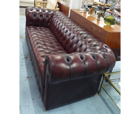 CHESTERFIELD SOFA, with buttoned red wine coloured upholstery, 266cm L x 74cm H.