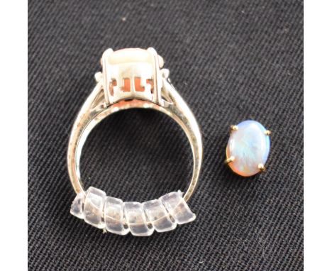 Gold (White) 9ct Ladies Ring (Size 'O') with a large blue stone in gold coloured mount and a small lightly coloured opal