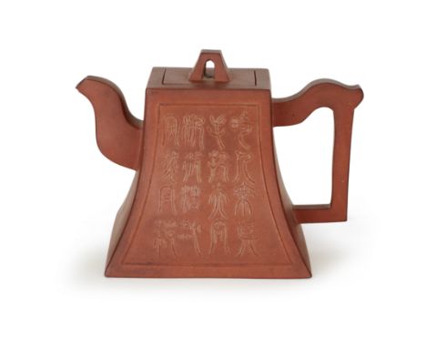 A Chinese Yixing red-clay 'calligraphy' teapot and cover20th centuryOf tapering square form, one side decorated in shallow re