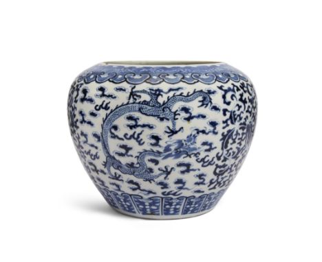A large Chinese blue and white dragon and phoenix scroll jarQing dynasty, 19th century, apocryphal Kangxi markPainted to the 