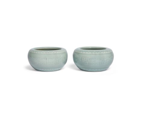 A pair of Chinese celadon-glazed alms bowlsRepublic period, apocryphal Qianlong seal marksEach with a central band of impress