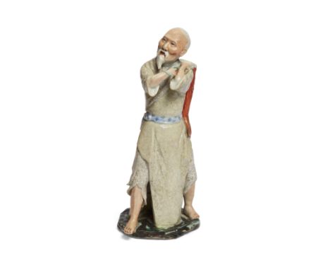 A Chinese famille rose statue of a fishermanRepublic period, Fujian Hui guan, Husen Jizao marksThe grey-bearded man wearing y