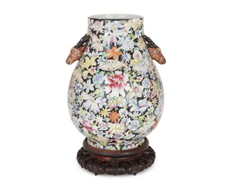 A Chinese famille rose millifluer twin handled vase, huLate Qing dynasty/Republic period, apocryphal Qianlong markThe sturdil