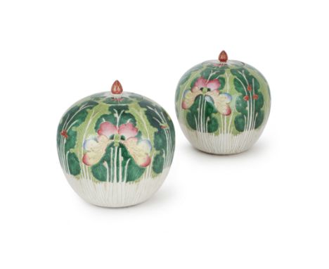 A pair of Chinese famille rose 'cabbage and butterfly' jars and coversLate Qing dynastyEnamelled around the exteriors with la