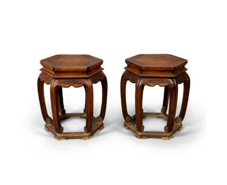 A pair of Chinese hardwood hexagonal stoolsLate Qing dynasty/Republic periodThe hexagonal tops with floating panels above rec