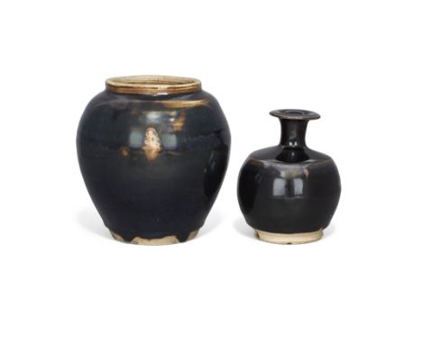 Two Chinese black-glazed stoneware vasesMing dynastyThe first, an oviform jar, the second, a bottle with flared rim.13.5cm an