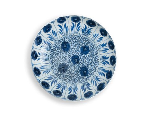 A Chinese blue and white 'Aster pattern' foliate dishQing dynasty, Kangxi periodTypically painted with chrysanthemum to the i
