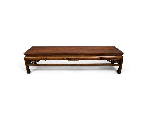 A Chinese huali wood low table, kang17th/18th centuryThe rectangular top above recessed waist and carved archaistic apron, wi