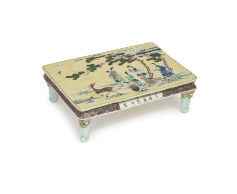 A Chinese biscuit famille verte scholar's tableLate Qing dynasty, apocryphal Kangxi markPainted with figures carrying a large