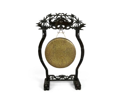 A Chinese copper-alloy circular gong and hardwood standRepublic periodThe stand carved and pierced with a design of bamboo an