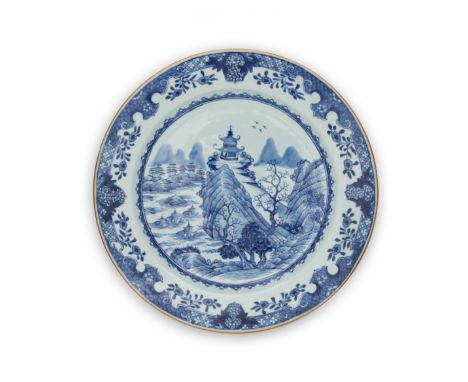 A large Chinese export blue and white 'landscape' plateQing dynasty, Kangxi periodPainted to the centre with a pagoda perched