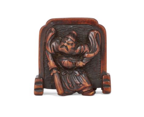 A Japanese wood netsuke of a screen flanked by an oni and a guardianEdo/Meiji period, 19th century, signed HidemasaCarved as 
