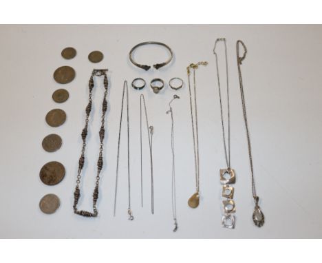 A collection of various coinage; a white metal torque bangle and various other silver and white metal jewellery to include ri
