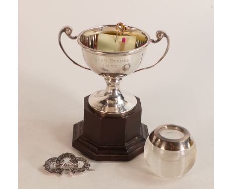 Silver Trophy on bakelite base, silver topped match striker, Silver brooch and 9ct gold horseshoe pin. (4) 