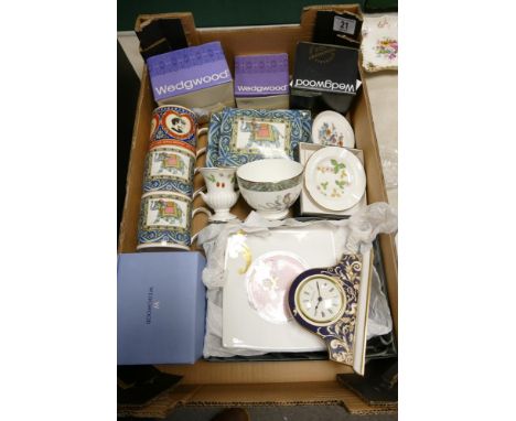 A collection of Wedgwood items to include Cornucopia patterned mantle clock, boxed Ethereal patterned square plates, cups lid