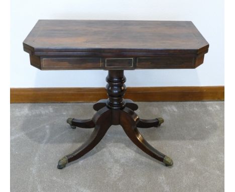 Early 19th century rosewood &amp; brass inlaid swivel &amp; fold over top, card table, measuring 91cm wide x 74cm high. 