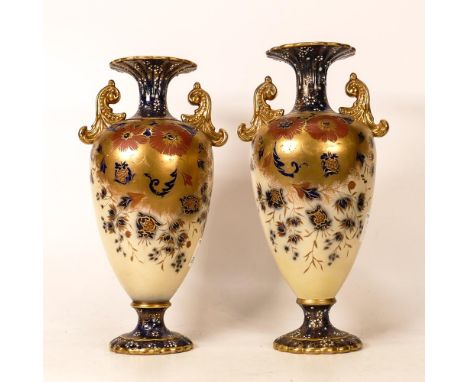 Carltonware Wiltshaw &amp; Robinson Ivory Blushware Twin Handled Baluster Vases in a Marguerite Pattern, flow blue ground wit