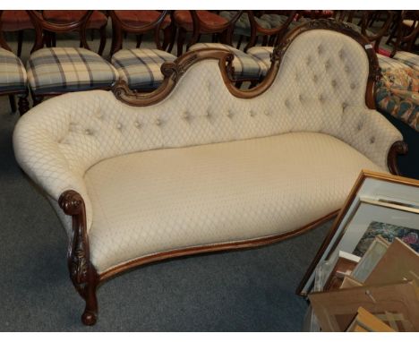 A carved mahogany framed chaise longue This is Victorian. Frame scuffed and scratched but structurally sound. Re-upholstered 