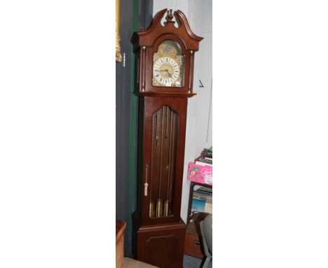 A reproduction Westminster chiming longcase clock, with three brass weights 