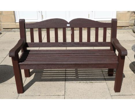 A stained hardwood garden bench