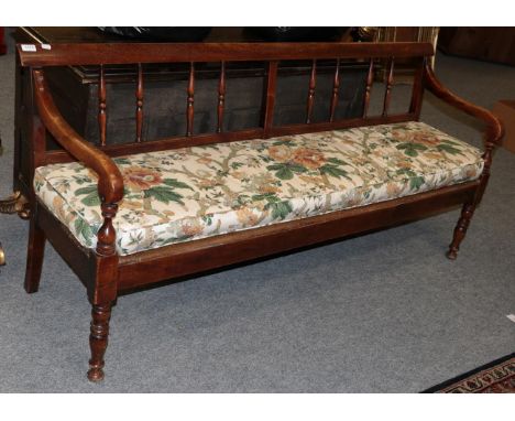 A 19th century mahogany spindle back bench
