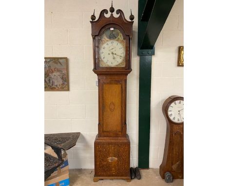 Longcase grandfather clock with painted face depicting Nelson, brass finials and column supports