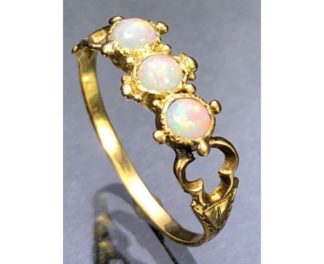 Delicate and ornate three stone Opal ring approx size 'M'