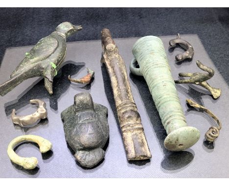 Collection of artefacts, possibly metal detecting finds, mostly Celtic, to include a bird amulet, libation cup, amulet, lunar