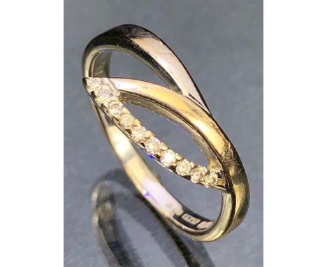 18ct White Gold contemporary styled ring set with ten Diamonds size 'O' and approx 3g