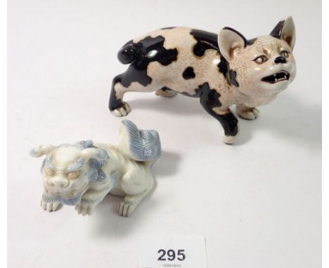 A Japanese porcelain model cat, 13cm and a Kylin dragon 