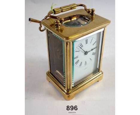 A late 19th century French brass carriage clock by Perrett, Paris,  with vintage lever platform escapement and key 