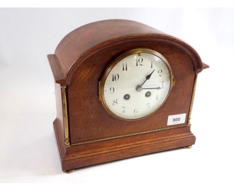 An oak 1920's mantel clock with enamel dial, 24cm tall 