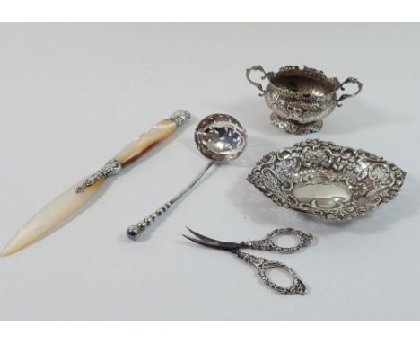 A silver pierced trinket dish, Birmingham 1886, silver scissors, Birmingham 1904, sifter spoon, Birmingham 1892, a French whi