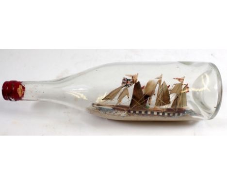 A Victorian model steam ship in a glass bottle, 28cm wide 