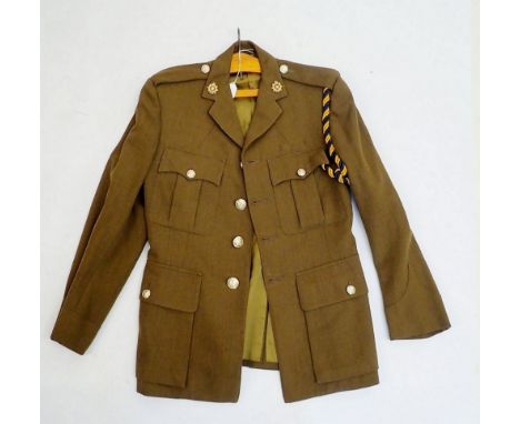 An Army officers army jacket with Royal Logistics buttons, collar badges etc. by Moss Bros 