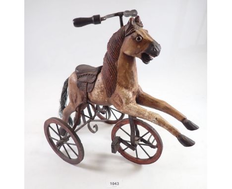 A miniature vintage velocipede horse, 37cm tall 