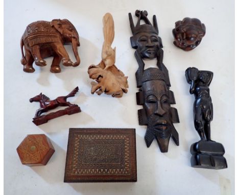 A collection of woodenware including ethnic hardwood figures, Buddha, card bird, box etc. 