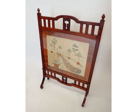 An Edwardian mahogany Arts & Crafts fire screen with slatted surround and embroidered panel, 66cm wide 