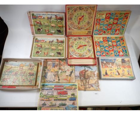 A collection of vintage jigsaws including Victory 