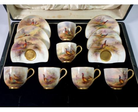 A set of six Royal Worcester coffee cans and saucers painted pheasants by James Stinton in a fitted case, lacking spoons - on