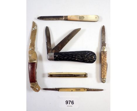 A silver and mother of pearl fruit knife and five penknives 