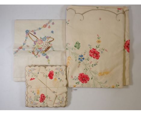 A vintage floral embroidered table cloth and matching napkins and other table linen 