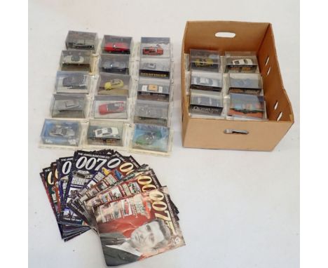 The James Bond Car Collection - group of twenty three model cars and magazine, cars all in original packaging, includes Aston