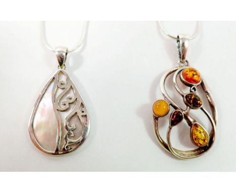 A silver and amber pendant and a silver and mother of pearl pendant on silver chain 