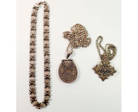 A large Victorian silver locket decorated flowers on a silver chain, 50g, a silver Jewish cross pendant (with later brooch pi
